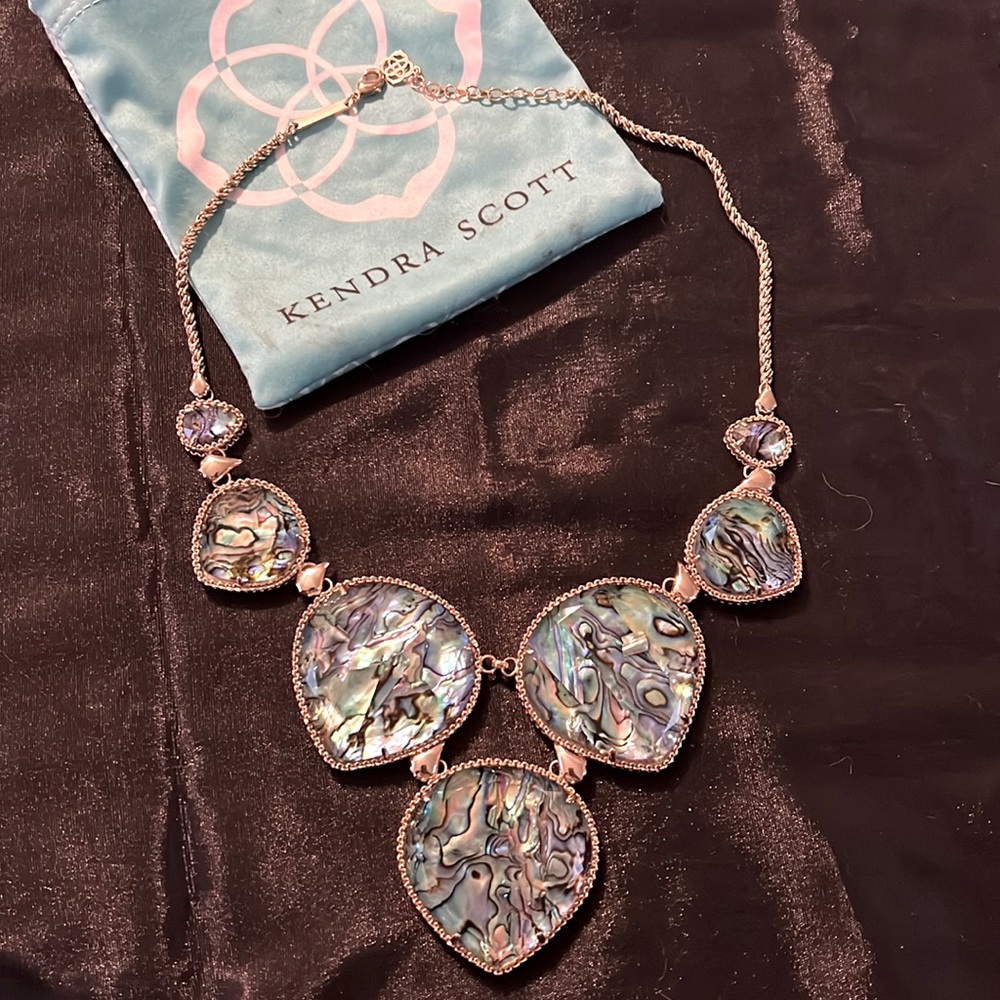 Kendra Scott abalone statement necklace with Kendra Scott bag.